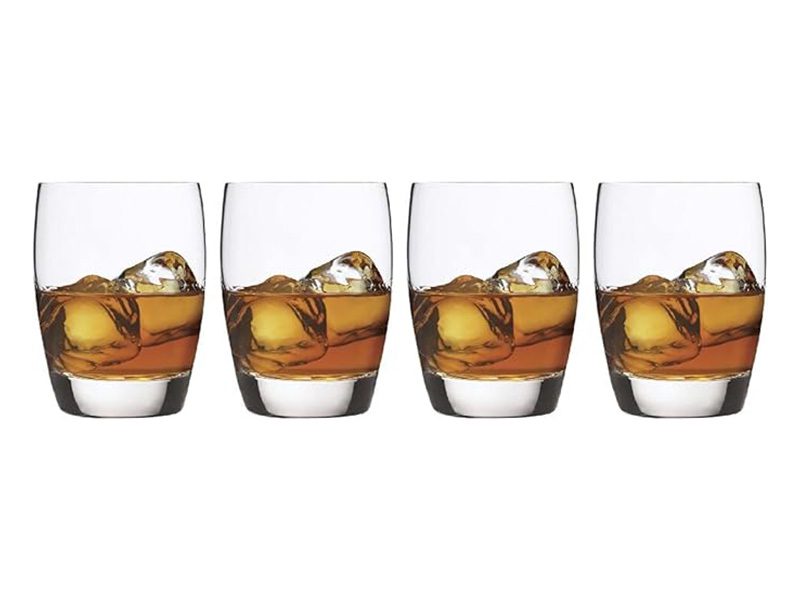 Four whiskey tumblers in a row