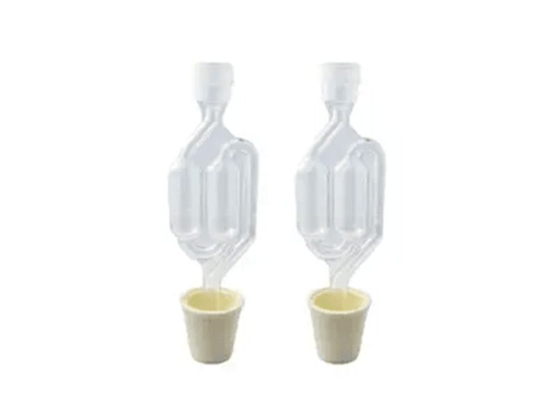 Two clear airlocks with white stoppers